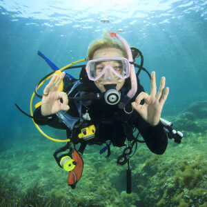 young-woman-scuba-diving-signals-okay-9